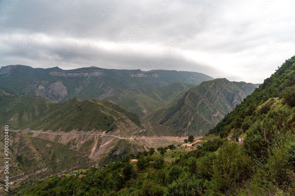 Naklejka premium Caucasian mountain. Dagestan. Trees, rocks, mountains, view of the green mountains. Beautiful summer landscape.