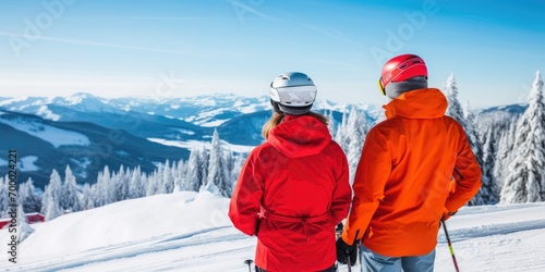Photo of a couple skiing seen from behind copy space 