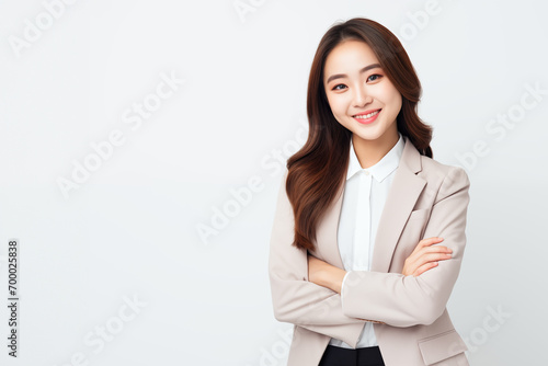 Portrait of young asian business woman confident smiling, wearing business suit, elegant professional, standing pose arms crossed, studio isolated white background with copy space, banner, sale