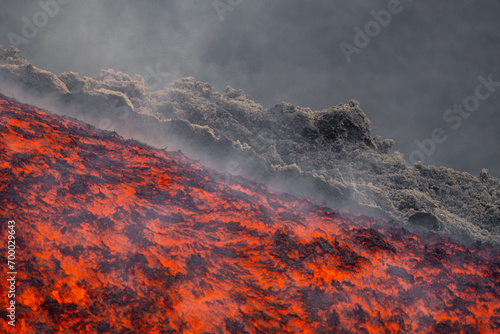 Eruptive vent with lava emis at the top of the Etna volcano photo