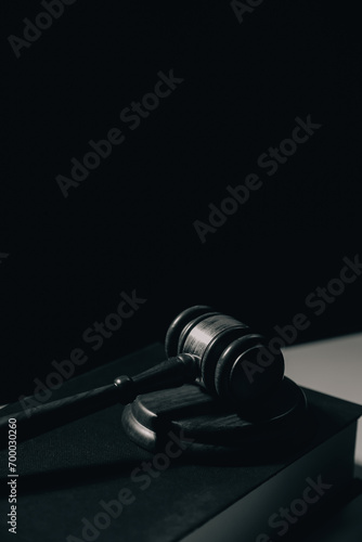 image of judge's hammer, scales lady of justice, law book, laptop computer and contract documents with pen concept of law and justice.