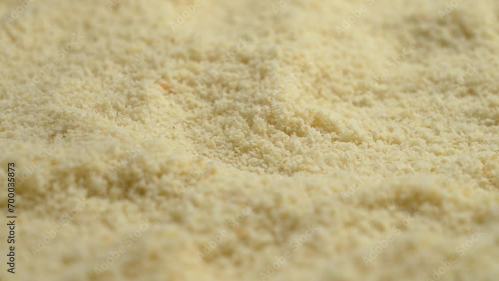 Texture of raw almond flour from ground nuts close up. Rotation Texture of raw almond flour from ground nuts close up. Rotation