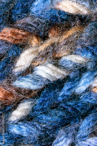 Large loops on blue wool knit fabric