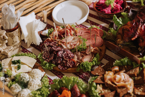 Cossack table. Banquet hall Meat treats for guests. Homemade cutouts. Pork tenderloin. Delicious meat cuts. Meat plate. Delicious compositions from smoked mint. Cottage cheese.