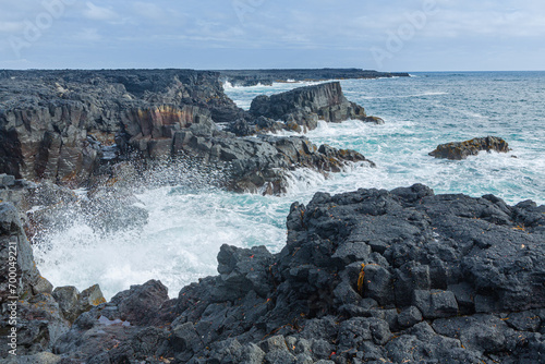 South coast of Iceland: waves crashing on black basaltic volcanic cliffs 