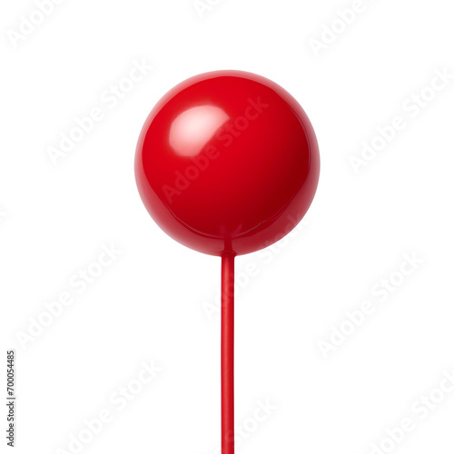 a red round object on a stick