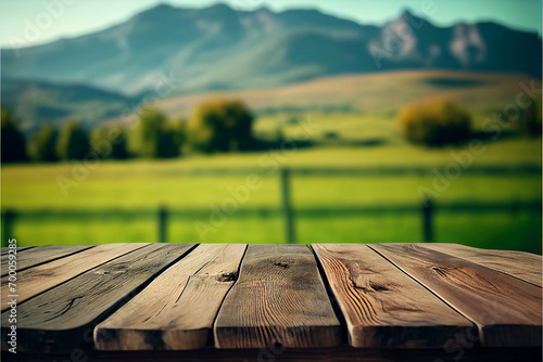 Wooden table against the background of green meadows. AI generated. © StockMediaProduction