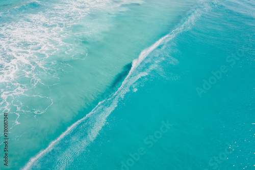 Clear ocean and surfing wave. Surfing dream in tropics. Aerial view