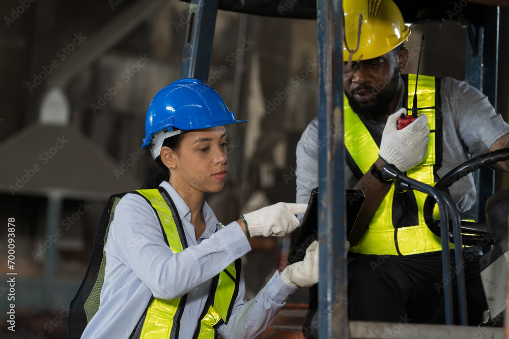 African American male and female engineer driving and operating on ...