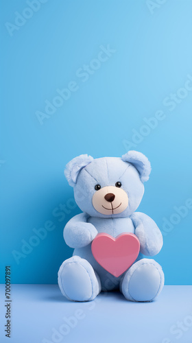 blue teddy bear holding a red heart © Jewel