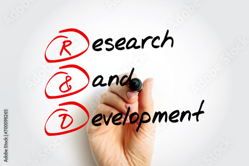 R and D - Research and Development is activities that companies undertake to innovate and introduce new products and services, acronym text concept background photo