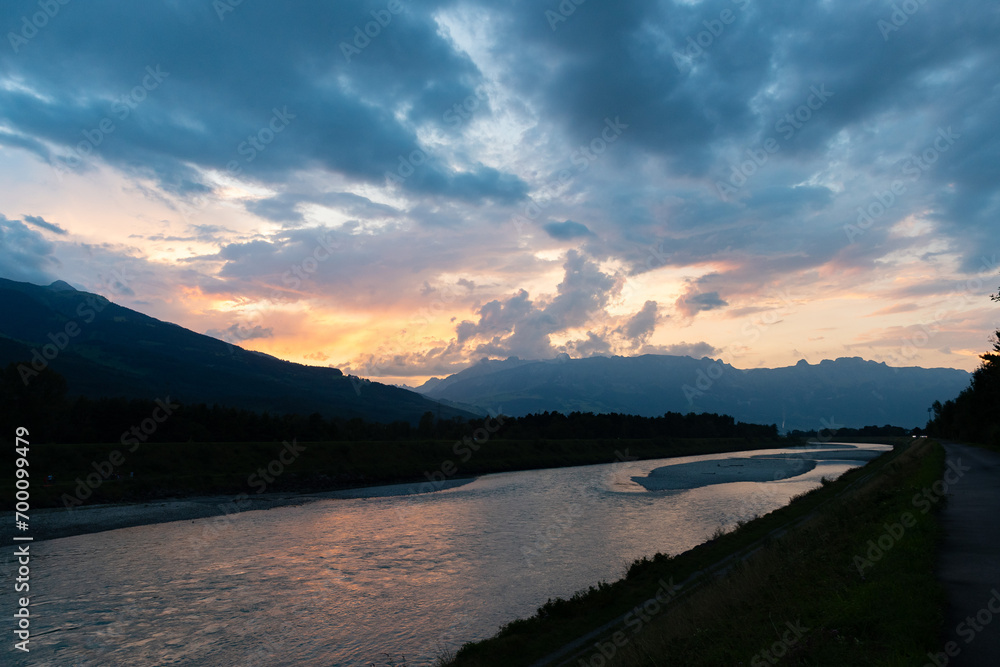 Sunset at the rhine river in Vaduz in Liechtenstein