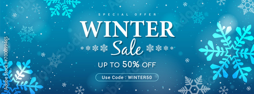 Winter sale promotion banner vector illustration. Snowflakes bokeh on blue background.