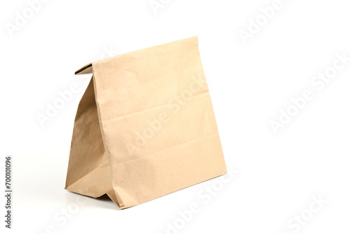 Close and full paper disposable bag of brown kraft paper isolated on white background.