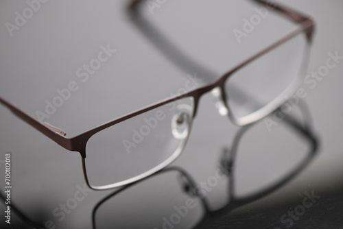 Reading glasses isolated on mirror background