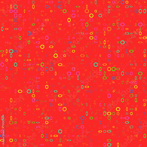 Seamless background from multi-colored rings on a red background.