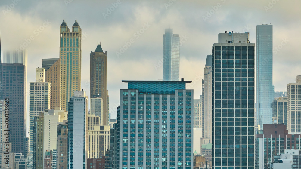Foggy downtown skyscraper buildings in Chicago aerial, gloomy big city, daytime