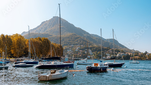 Lecco lake with sailboats at bay