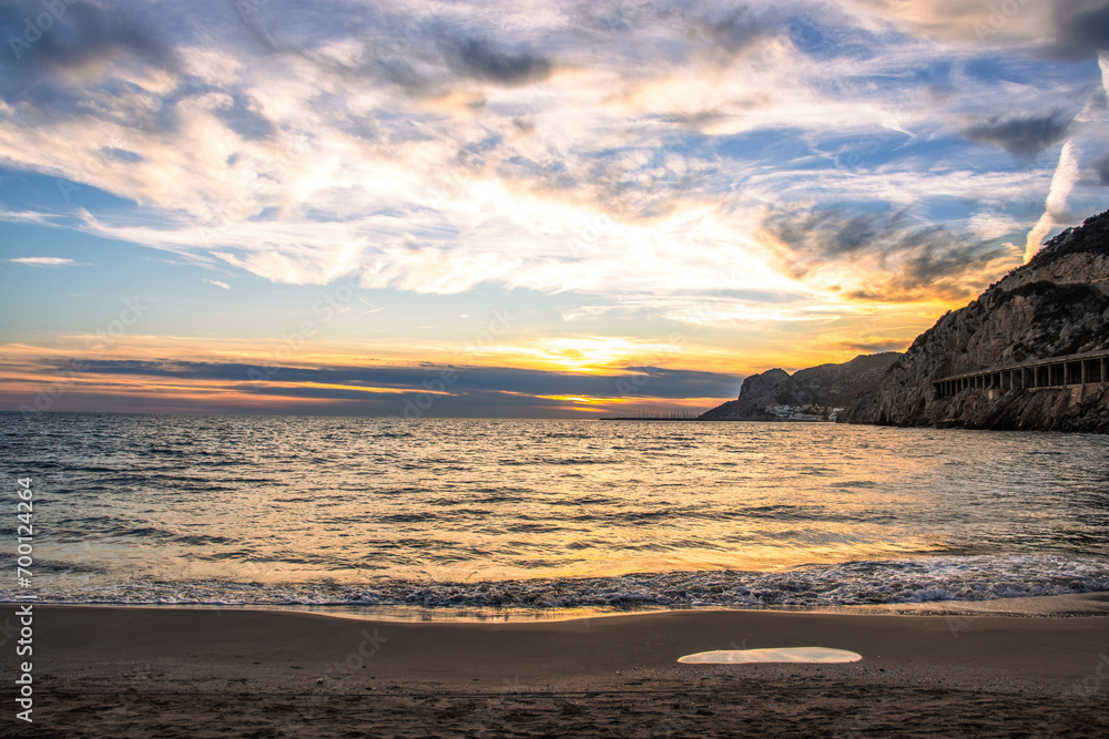 Amazing panoramic landscape of rocky shore photo. Sunrise sundown sky with colorful clouds. Mediterranean sea.