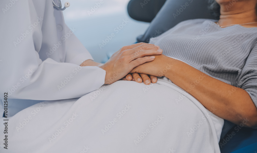 Doctor taking care, help and encourage Asian elder senior woman patient in clinic hospital. Doctor taking care, help and encourage Asian elder senior woman patient in clinic hospital.