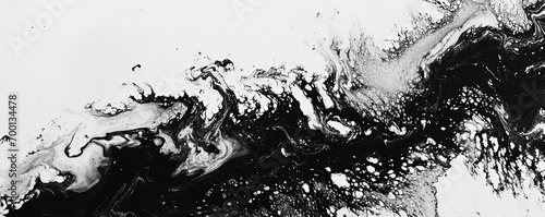 Abstract fluid art in monochrome tones - a dynamic combination of black and white paint to create unique patterns and textures.