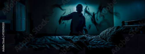person in bed, seemingly caught in the throes of a nightmare. The dark room is illuminated by a single light source, casting eerie shadows that resemble spectral figures around the restless sleeper