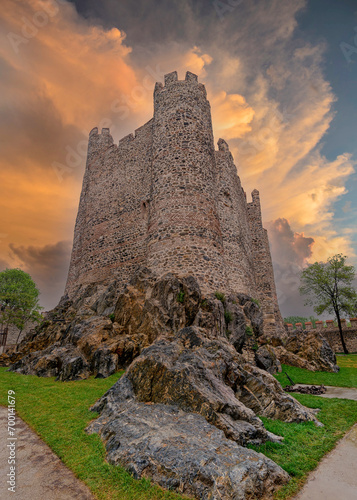 Sunset shot of Anadolu Hisari, or Anatolian Castle, a 13th century medieval Ottoman fortress built by Sultan Bayezid I, on the Anatolian side of the Bosporus in Beykoz district, Istanbul, Turkey photo