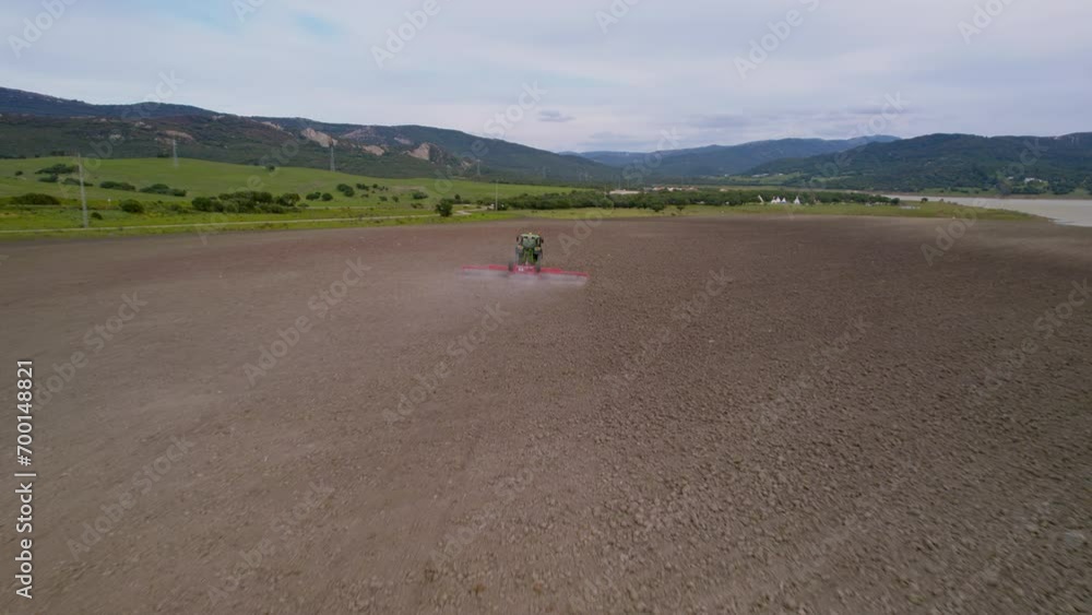 The harvester drives through the field and plows the land The harvester drives through the field and plows the land
