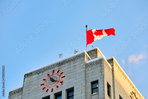 Below view Vancouver City Hall with Canadian flag. photo