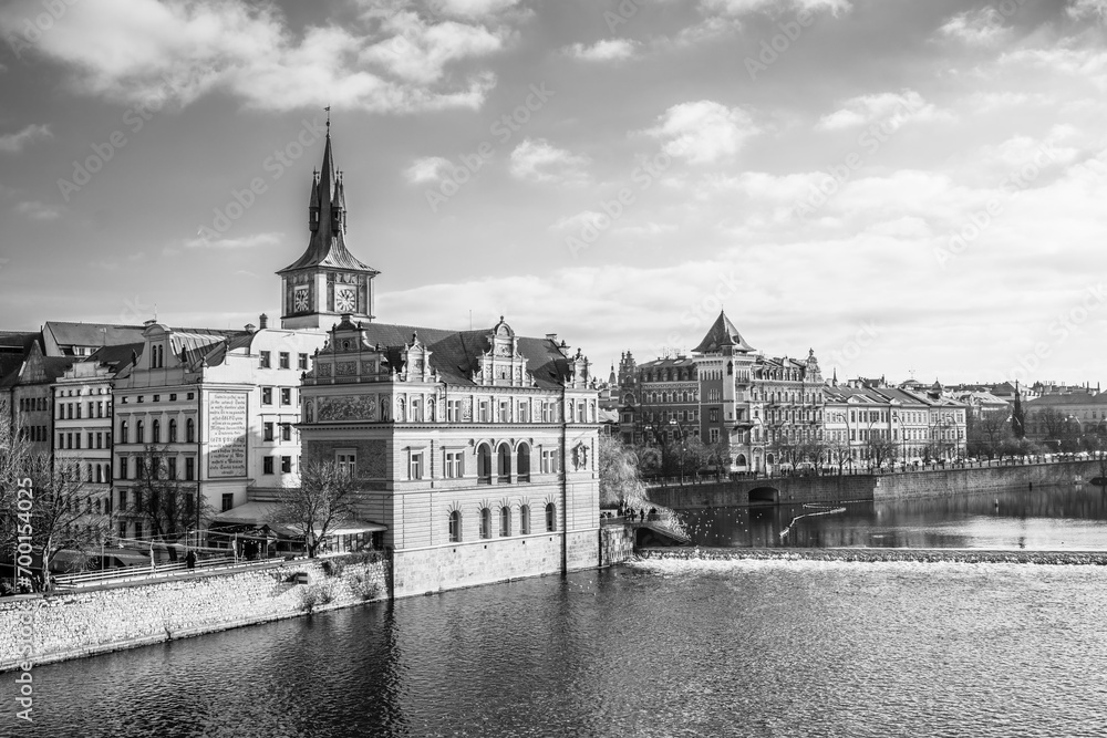 Fototapeta premium Bedrich Smetana Museum at Vltava River. Smetana embankment in Prague, Czechia. Black and white photography.