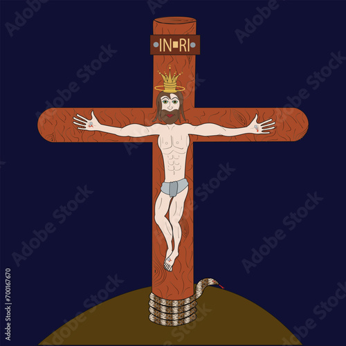 Jesus Christ hangs crucified on a wooden cross. At the bottom of the cross there is a snake, and above the Lord’s head hangs a sign with the inscription, King of the Jews. photo