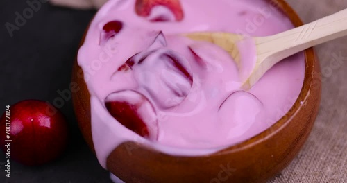 Wallpaper Mural take with a spoon cherry yogurt made of cream with the addition of pieces of sweet cherries, yogurt with taste and pieces of cherries Torontodigital.ca