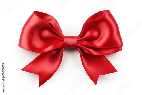 Christmas bow made out of a red satin ribbon, a decorative and festive element for gifts and celebrations.
