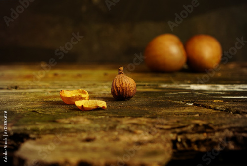 still life with avocado seeds, small roses and other gift of mother nature. Italian style
