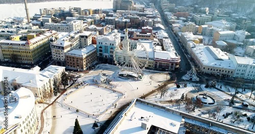 Aerial view of an old residential buildings covered with snow. Podil Kontraktova Square in Kiev 2022 photo