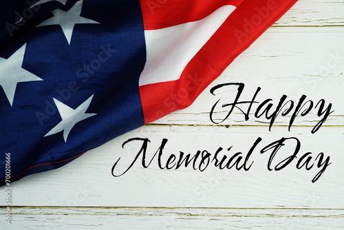 Happy Memorial Day text messege with USA flag on wooden background