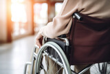 Close-up of a senior person navigating with a wheelchair.