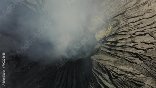 Drone flight through creater of Bromo volcano in east java, Indonesia on a beautiful sunny day photo