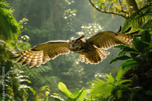 The Philippine Eagle-Owl in flight against the backdrop of a vibrant tropical forest
