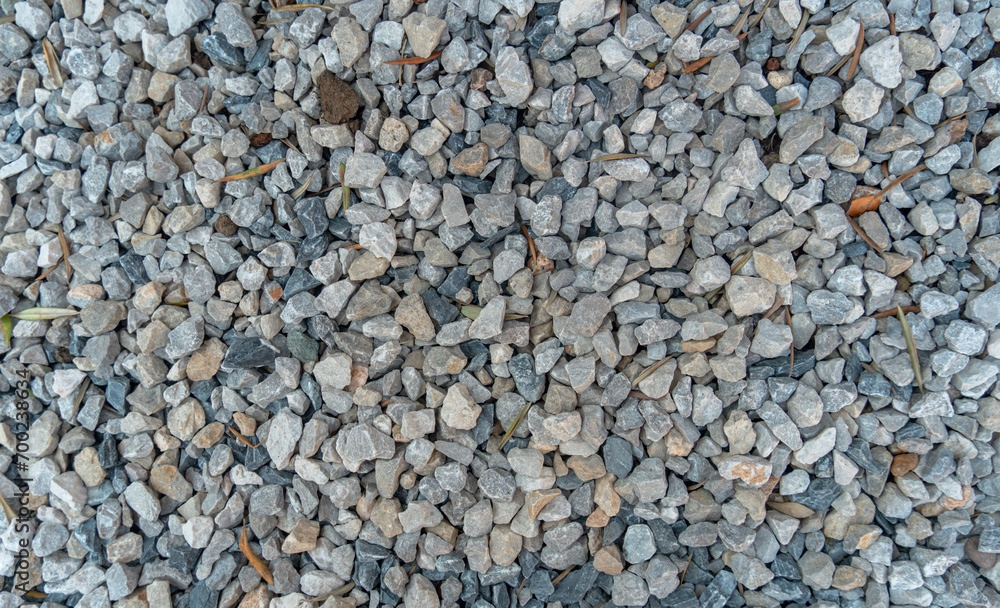 Gravel for texture or background. Mound of granite gravel, stones, crushed stone close-up. Rough seamless texture, construction material background. Gravel for texture or background. Mound of granite gravel, stones, crushed stone close-up. Rough seamless texture, construction material background.