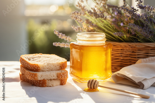 Close-Up of Golden Herbal Honey in a Jar. Summer Delicious Sweetener with Bread and Lavender.