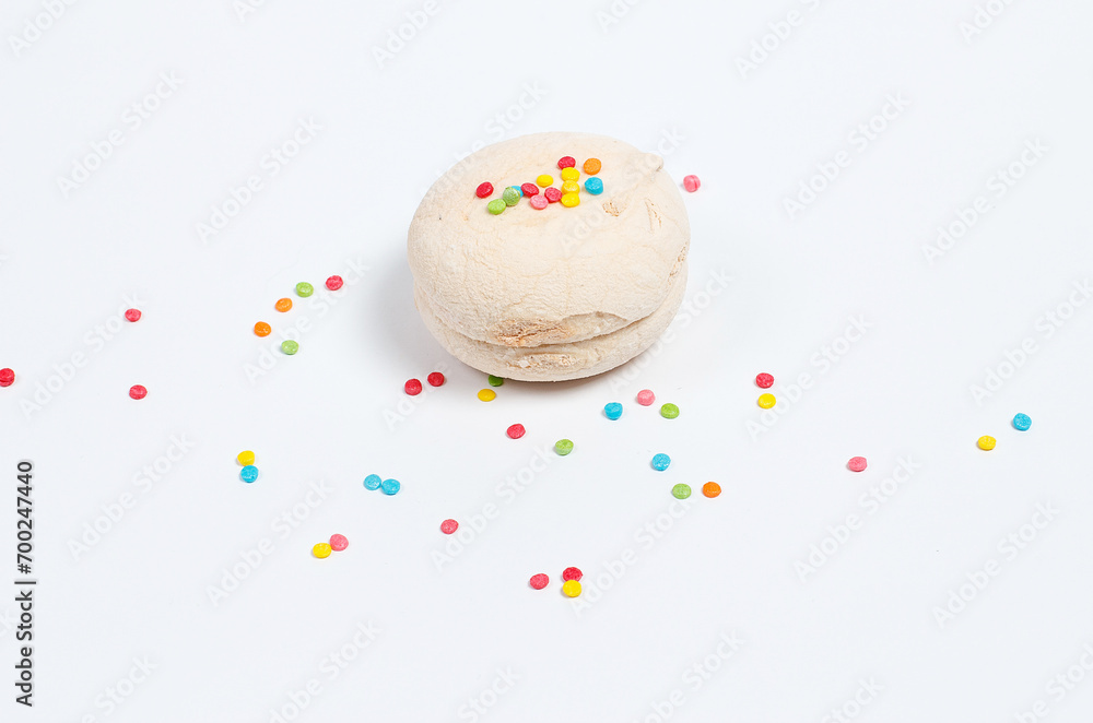 Marshmallows of different colors on a white background