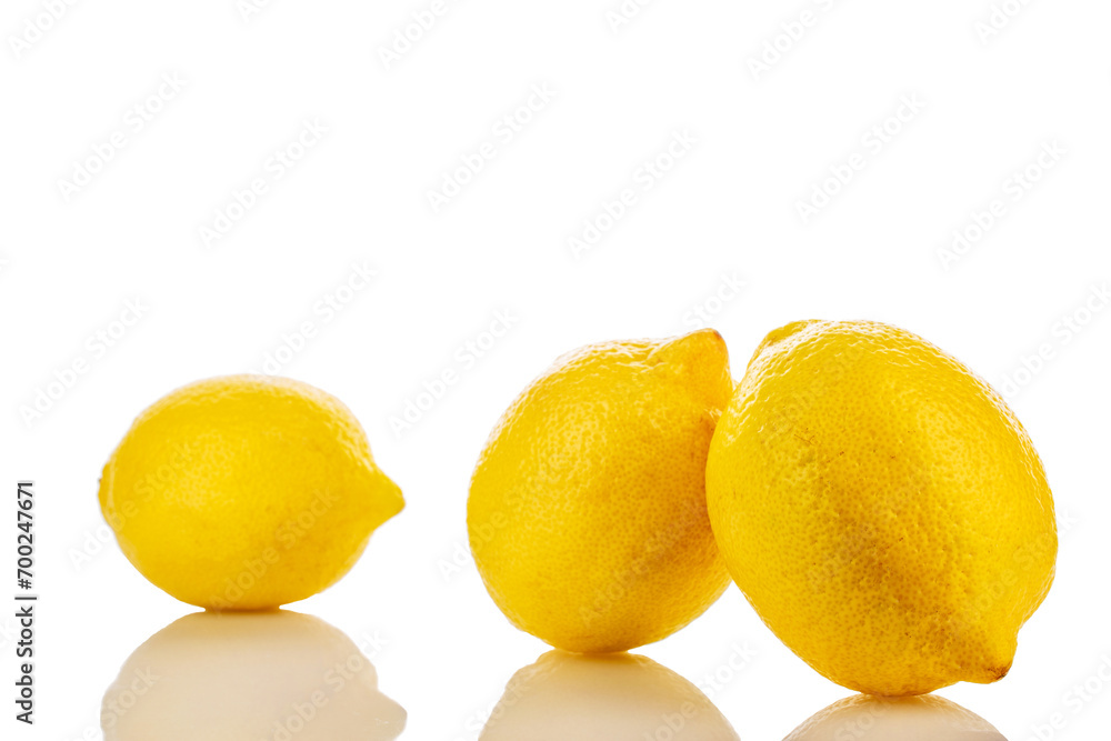 Three yellow juicy lemons, macro, isolated on white background. Three yellow juicy lemons, macro, isolated on white background.