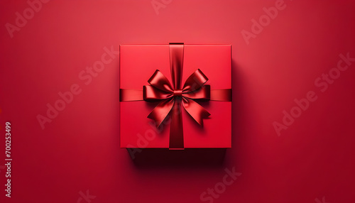  Red gift box with ribbon top view and red background. Ai Generative