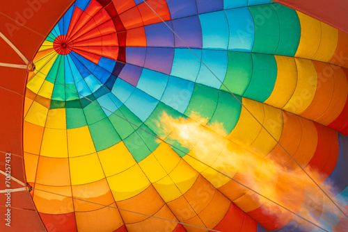 Hot air balloon with a burner flame background
