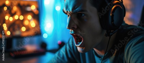 Man, shocked by opponents in online game, opened mouth. photo