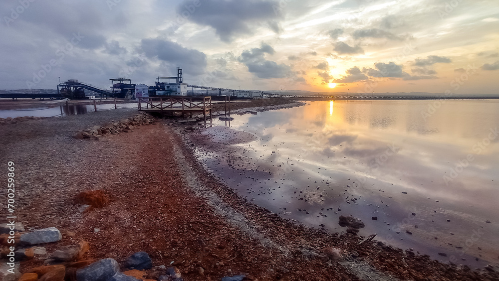 Sunset at the pink lagoon of the sea salt industry in Torrevieja, Spain