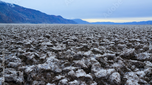 Death Valley National Park, Salt with clay, California. Smooth salt valley with cracked and swollen salt, dead salt landscape photo