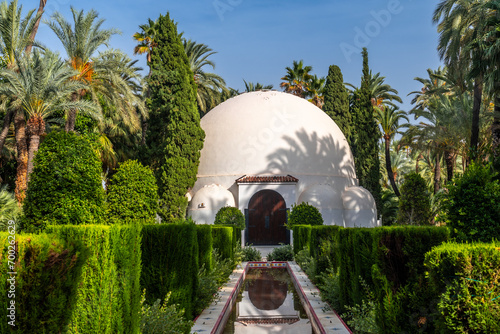 Visitor center building and fountain in the palm grove park in the city of Elche. Spain photo