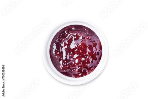 Raspberry sweet confiture in a bowl on a white isolated background